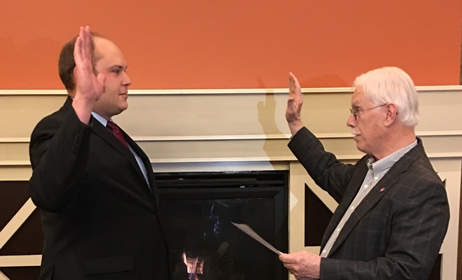 Commissioner Brian Wolfe, a notary public, swears in Eric LaBrant as a Port of Vancouver USA commissioner on Dec. 28, 2015