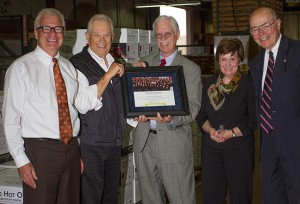 Commission president Brian Wolfe presents the port's 2013 Tenant of the Year award to Cadet. Left to right: Cadet president Hutch Johnson, Cadet CEO Dick Anderson, and port commissioners Brian Wolfe, Nancy Baker and Jerry Oliver. (Photo courtesy of Cadet)